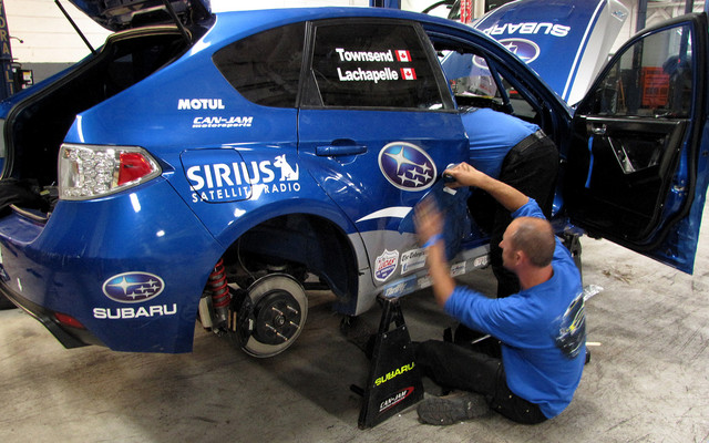 Nick Searancke fixing the doors late on Sunday at Capital Subaru 