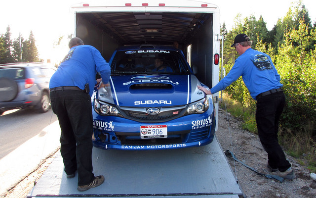 Andrew and Lewis help Stewart load the car after the last stage on Leg 1
