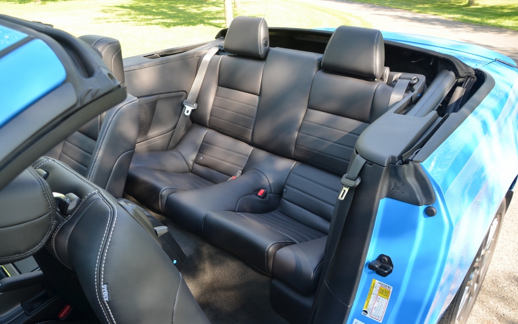 The very narrow backseats are easier to access when the top is down.