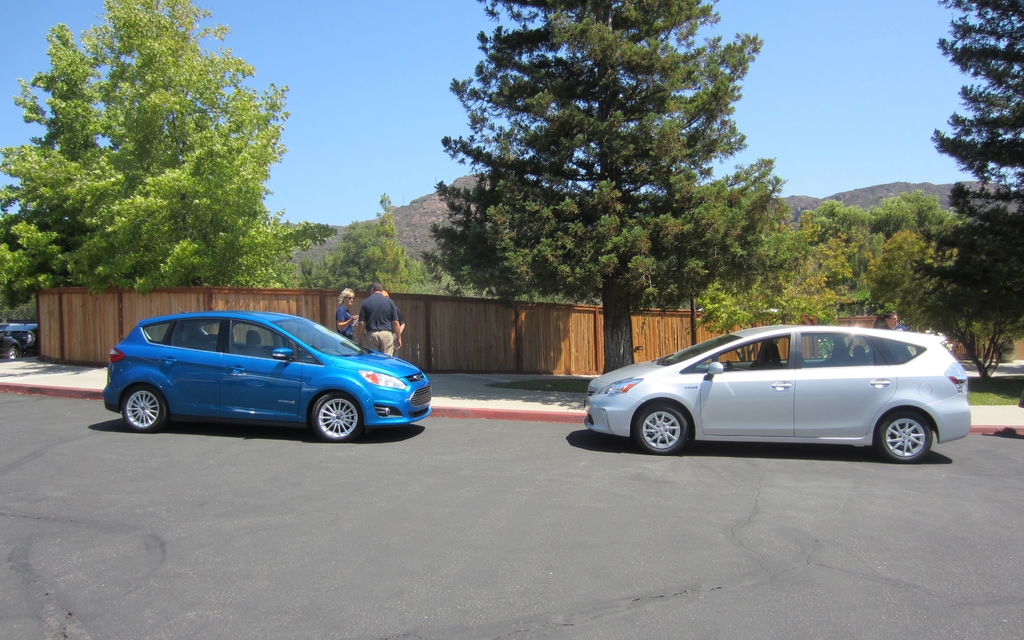 The 2013 Ford C-MAX Hybrid faces off against the 2013 Toyota Prius V.