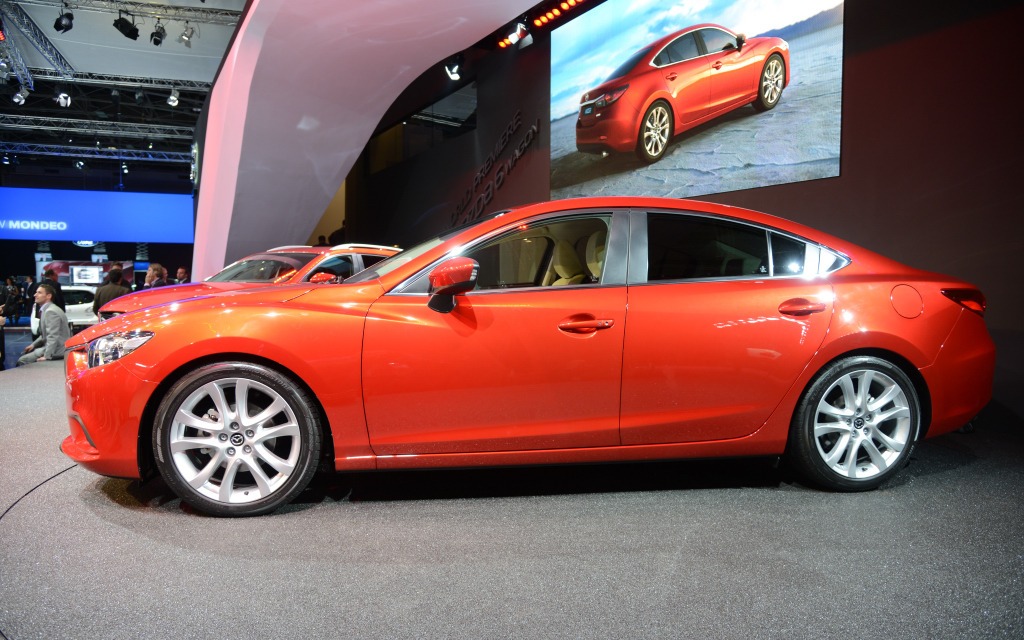 The rear of the sedan is strongly suggestive of sports car design cues.