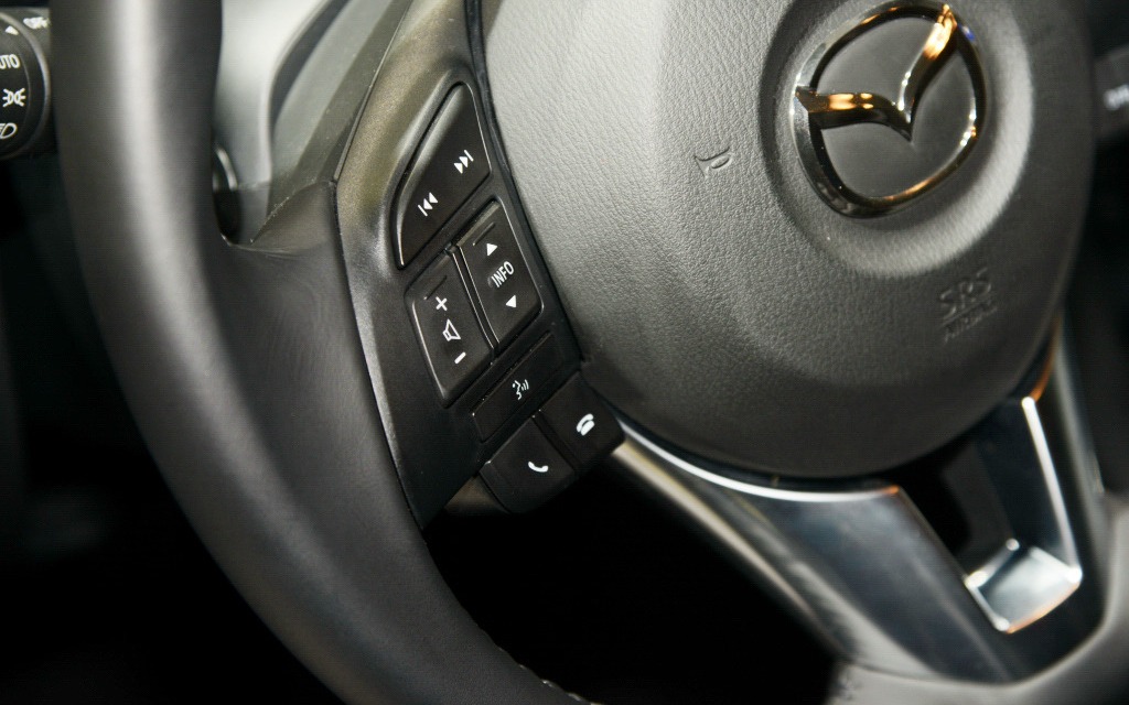 Like the competition, the steering wheel offers plenty of buttons.