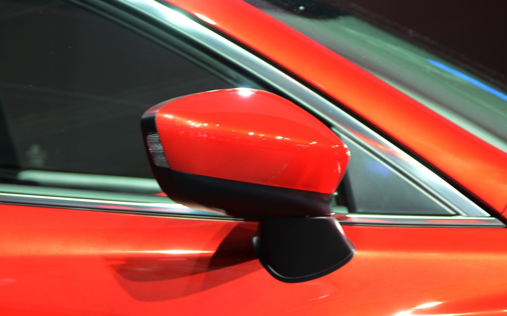 The side mirrors are anchored on the sedan's strong character line.