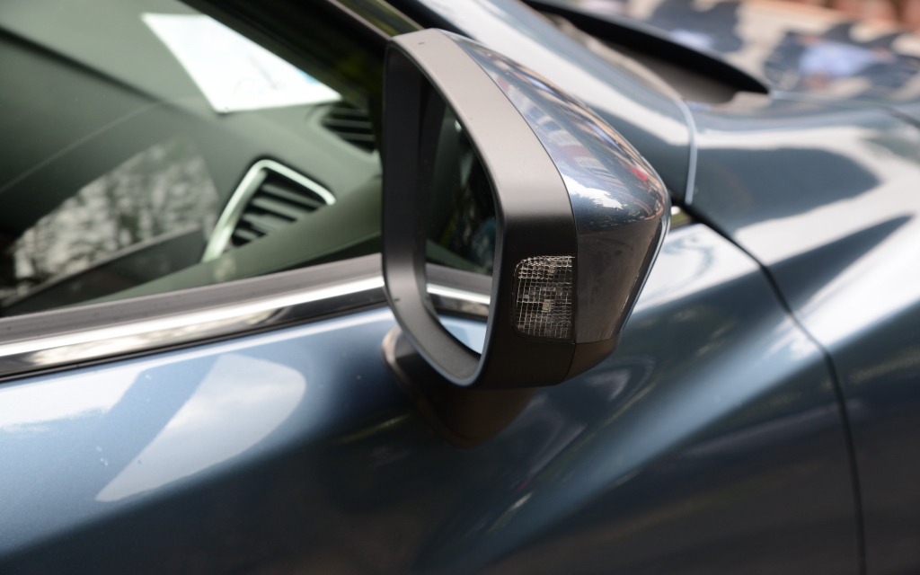 The rearview mirror has an integrated turn signal on the outer surface.