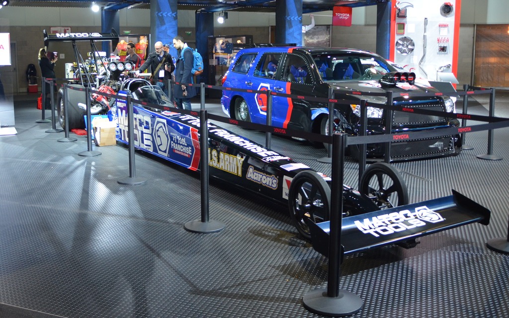 A Toyota dragster sits next to the Dragquoia of SEMA fame.