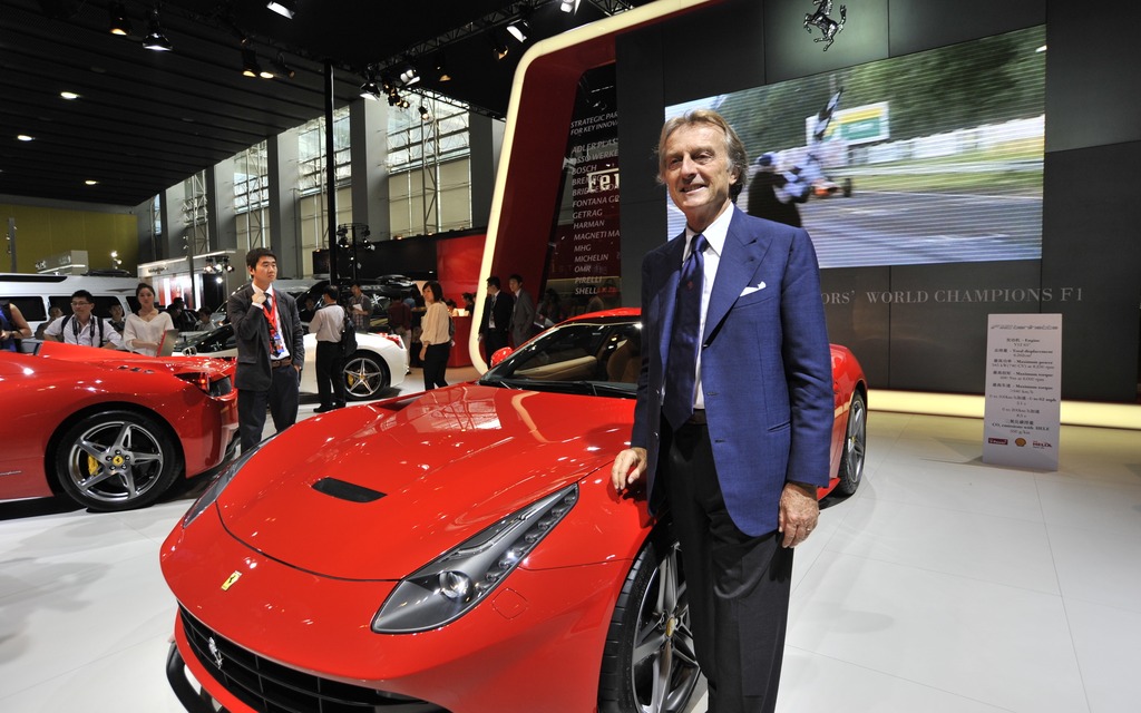 A proud Luca Di Montezemolo posing beside a 458 Italia.