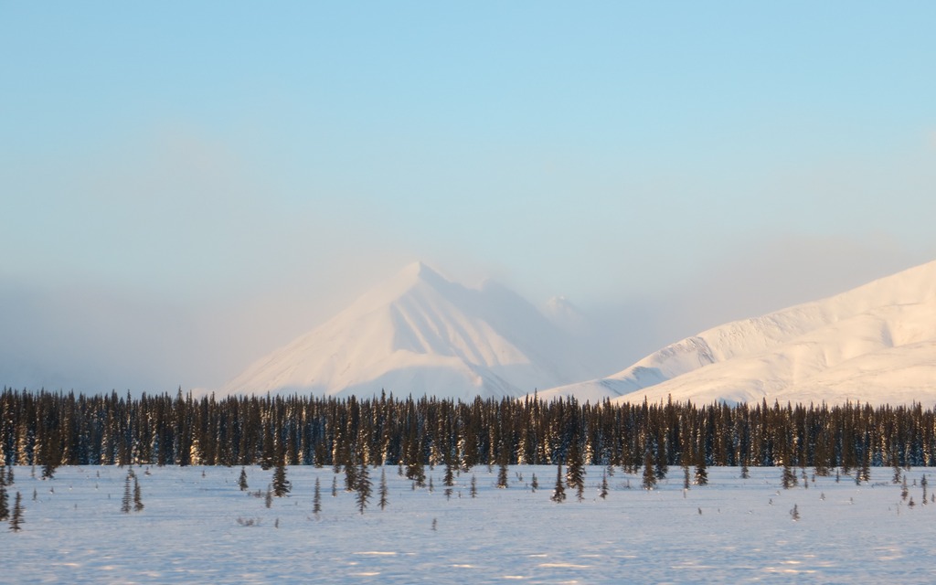 Snow blows from peak-to-peak in the Alaska Range.