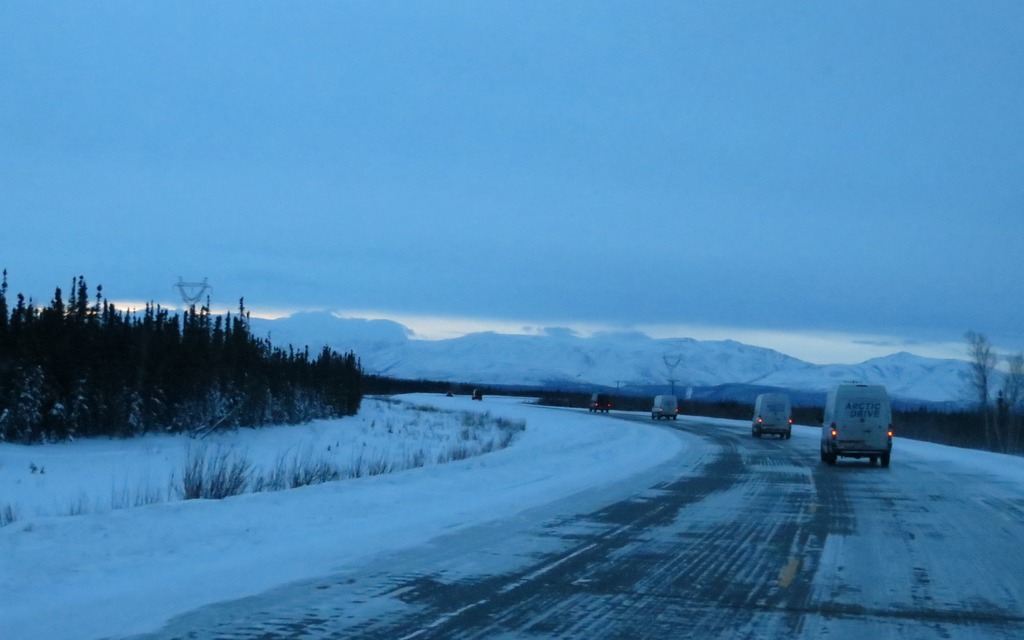 Our convoy trucks industriously to the south under the Alaskan dawn.