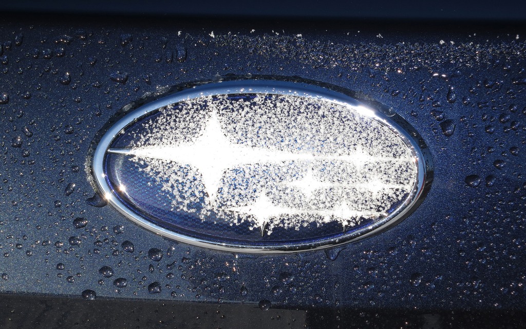 The Subaru insignia with a sprinkle of snow 