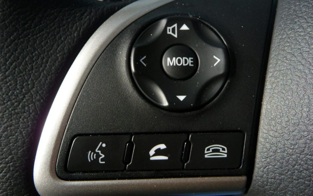  The audio and phone controls are on the left spoke of the steering wheel.