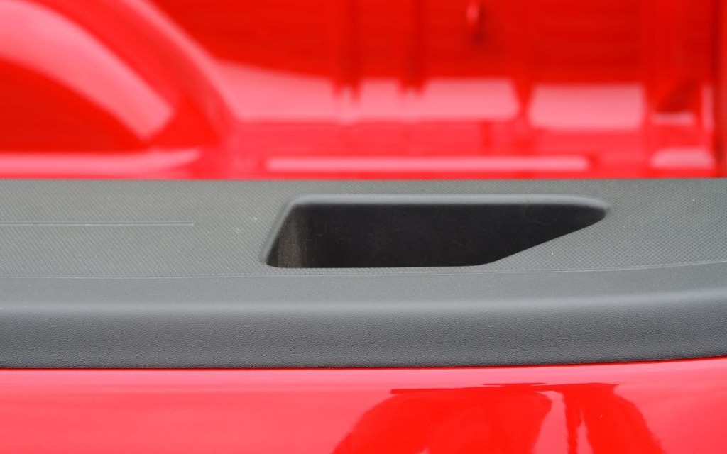 Getting into the flatbed is easier thanks to these hand holes on its side.