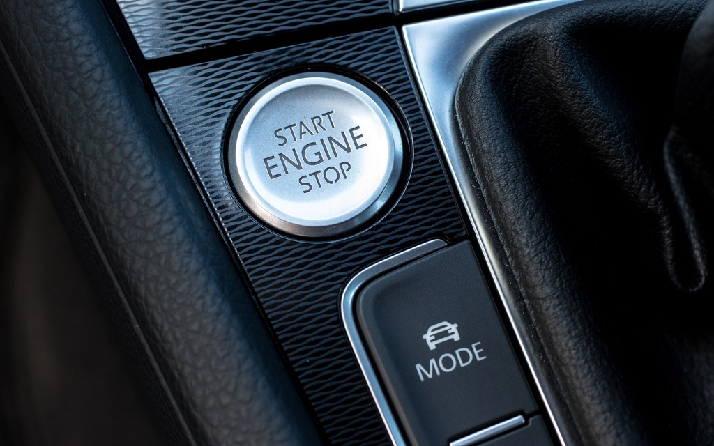 Ignition button and Adaptive Chassis Control switch.