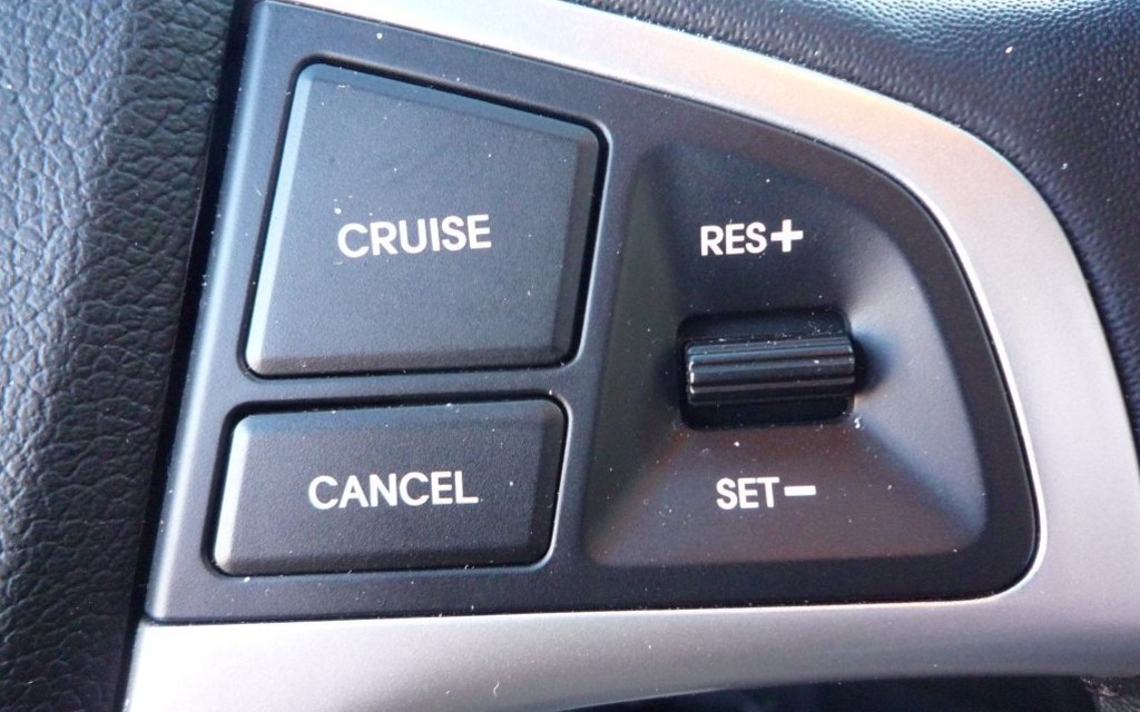 The cruise control commands are on the right spoke of the steering wheel.