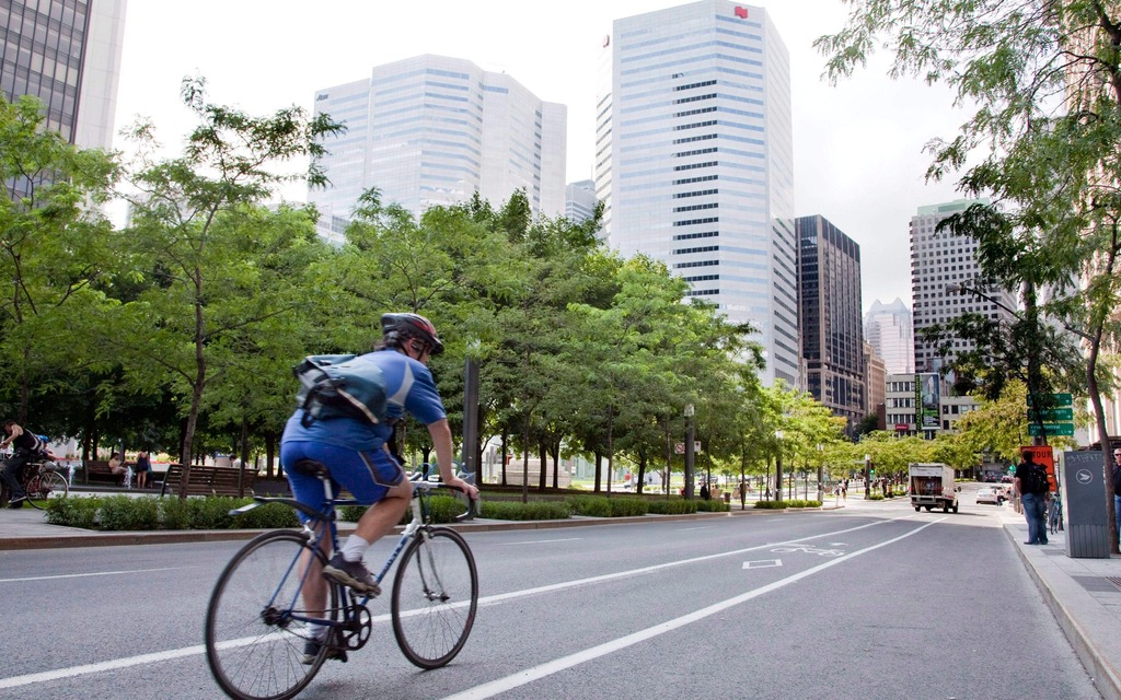 A cyclist rolls down a bicycle lane in downtown Montreal on August 13, 2010
