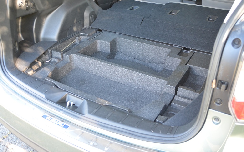 These storage compartments under the trunk floor are handy.