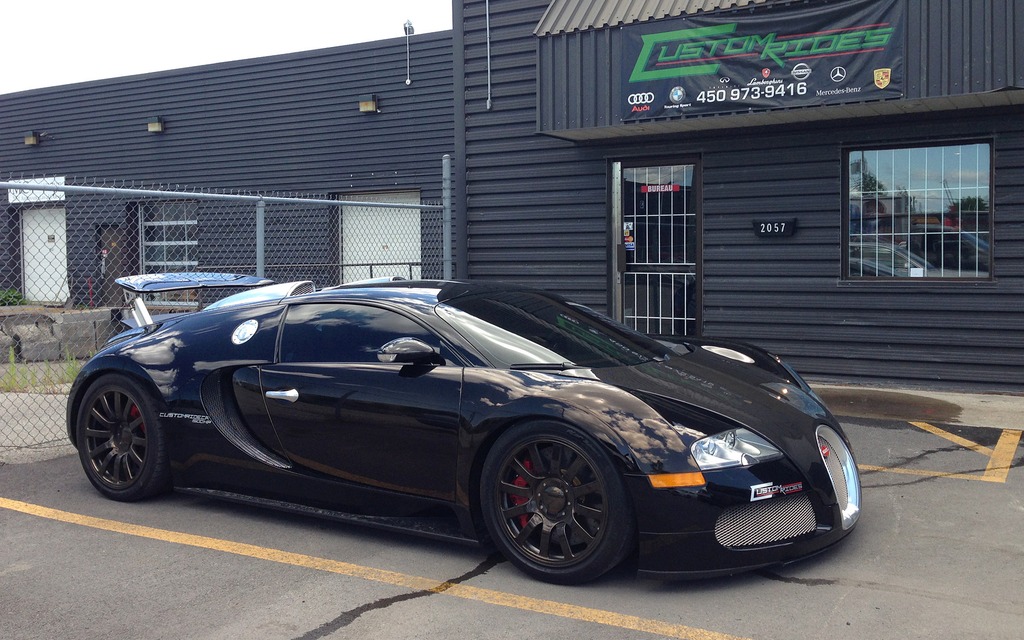  parked in front of the Custom Rides Workshop in Laval.