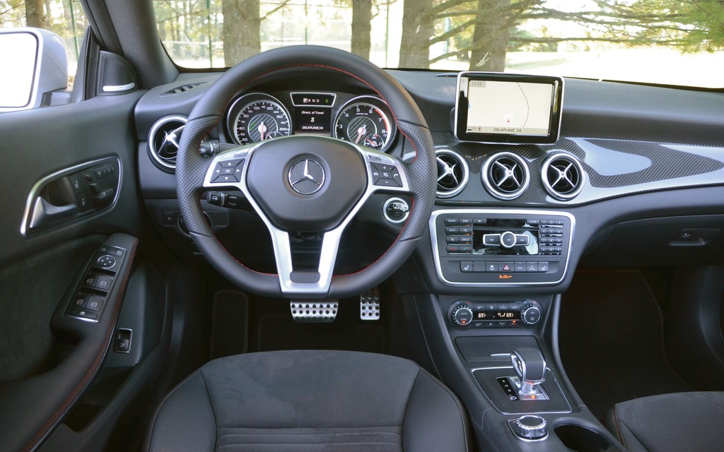 The AMG’s dashboard has carbon fibre accents. Notice the aluminum pedals.