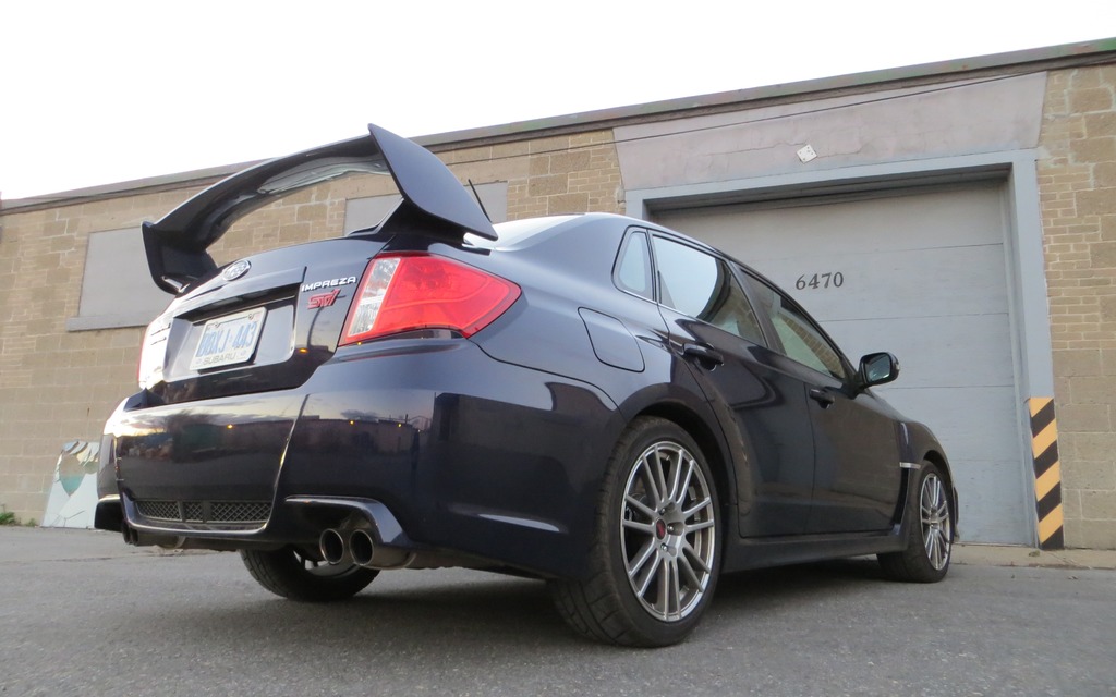 The 2013 Subaru WRX STI is unquestionably tightly sprung.