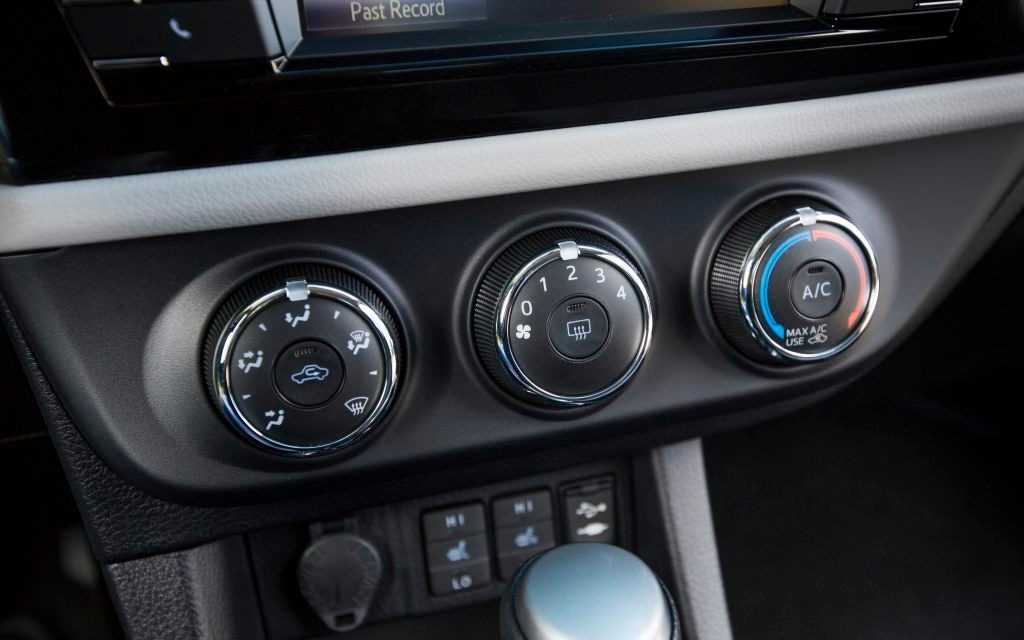 These three large buttons control the climate.