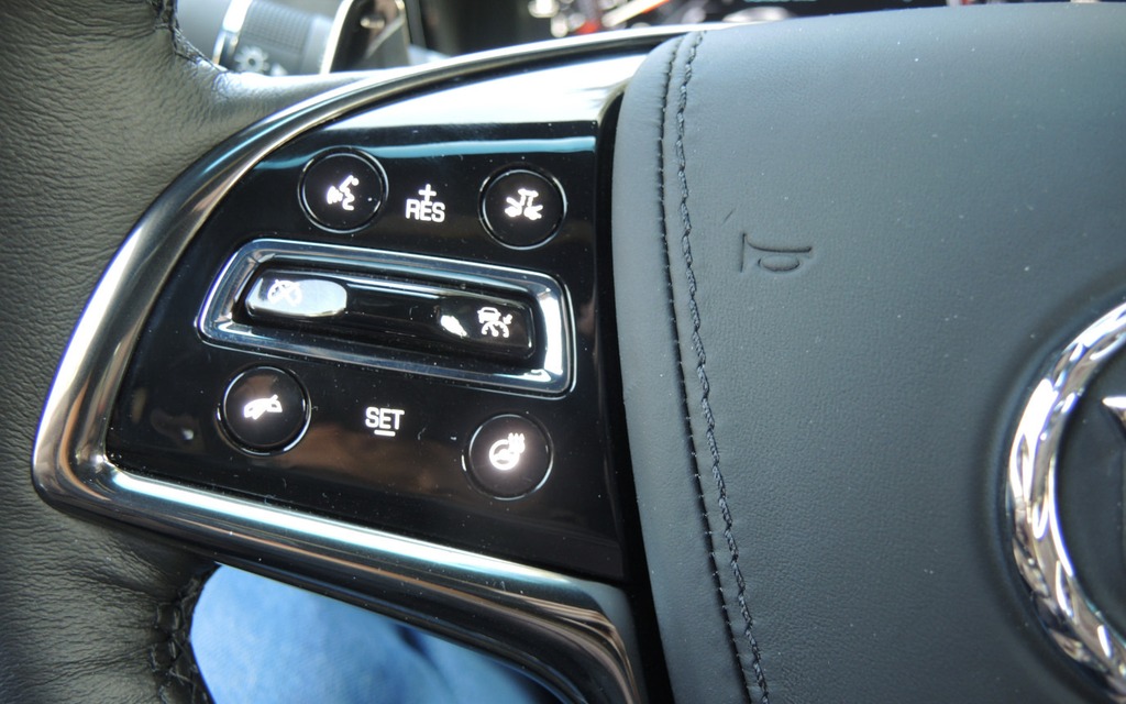 The cruise control is located on the left spoke of the steering wheel.