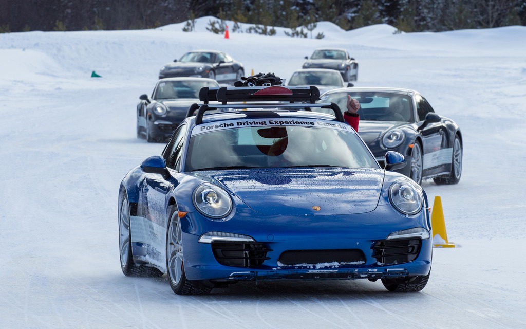  A caravan of Porsches heads toward the next exercise.