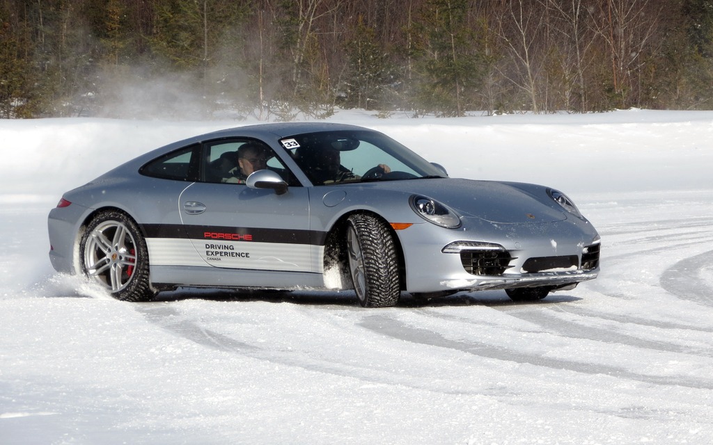 Costa Mouzouris skids around the ring of ice in a Carrera S.