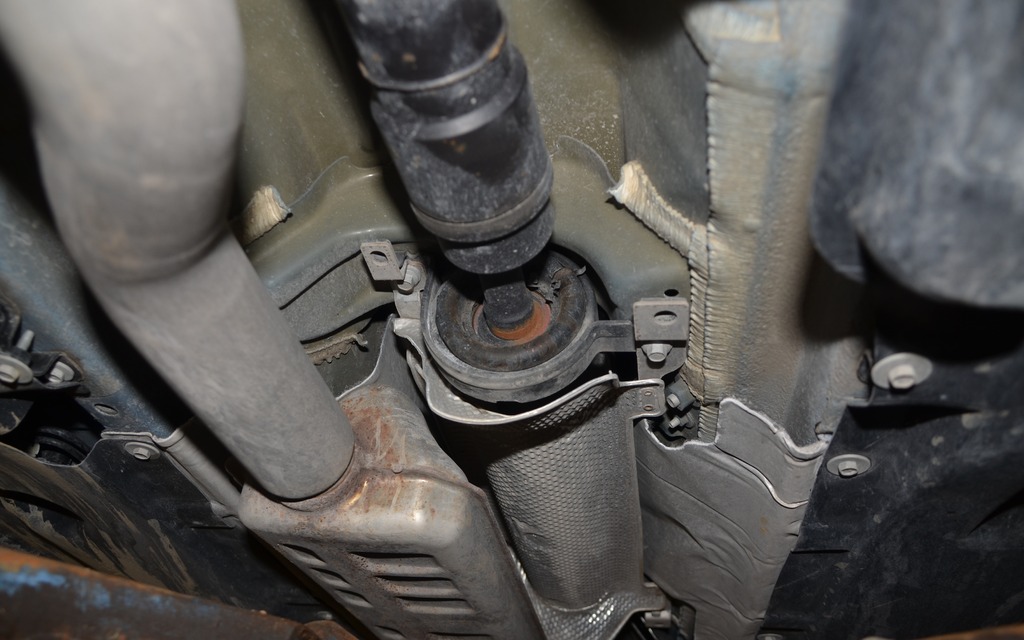 The bushing in the middle reduces vibrations from the drive shaft. 