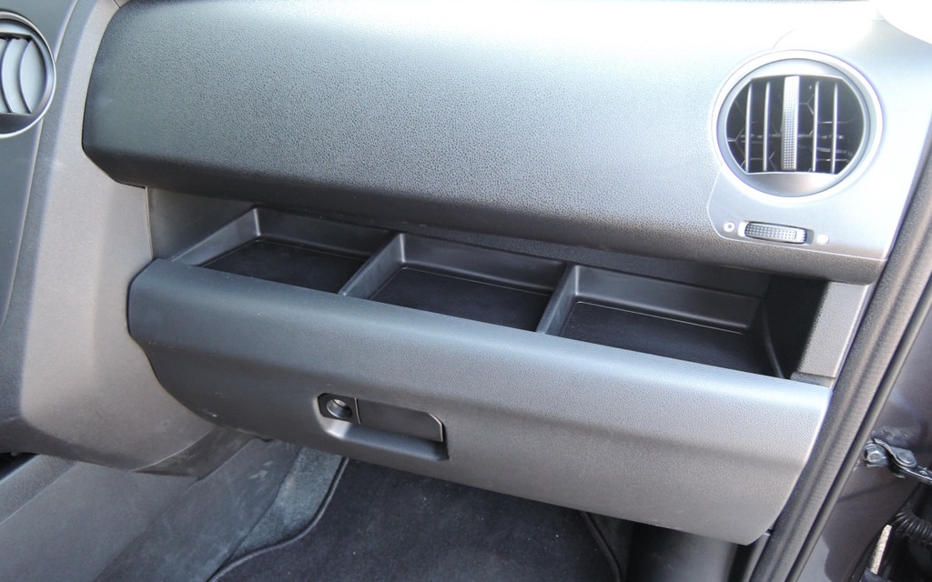 Storage shelf above the glove box.