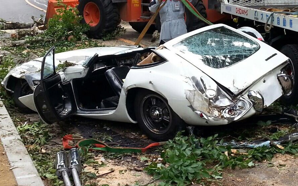 A Toyota 2000GT Crushed by a Tree - The Car Guide