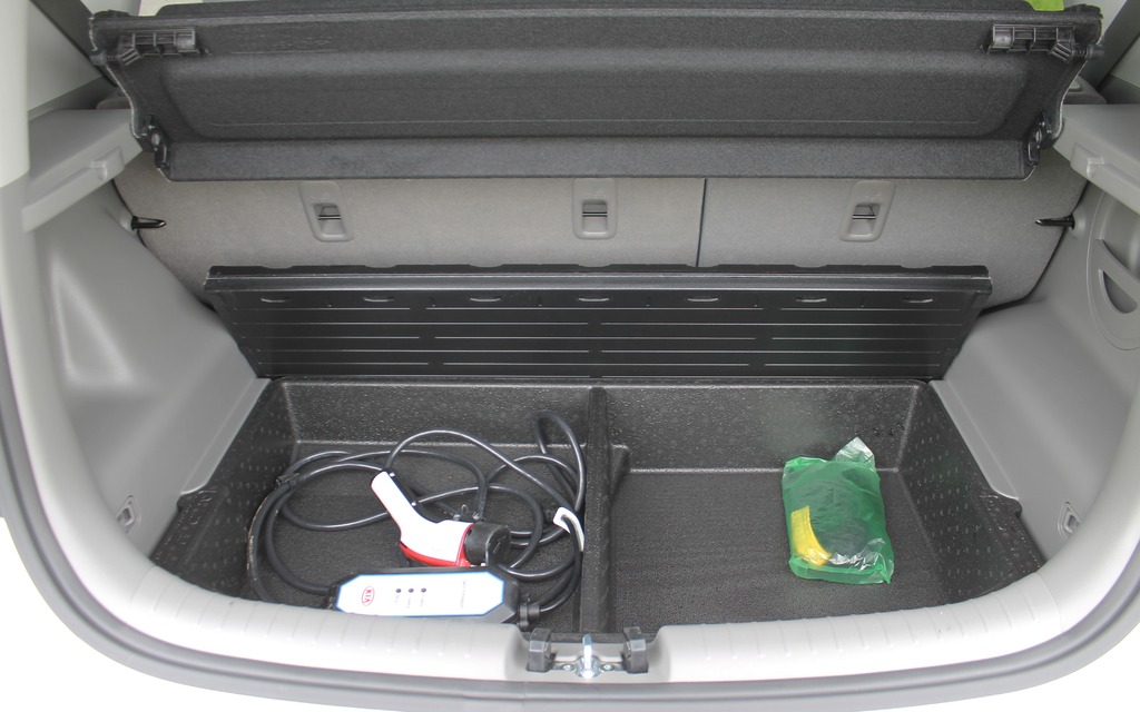Under the floor of the trunk is a wire for charging the battery.