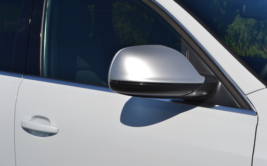 The front grille is metallic gray, as are the side rearview mirrors.