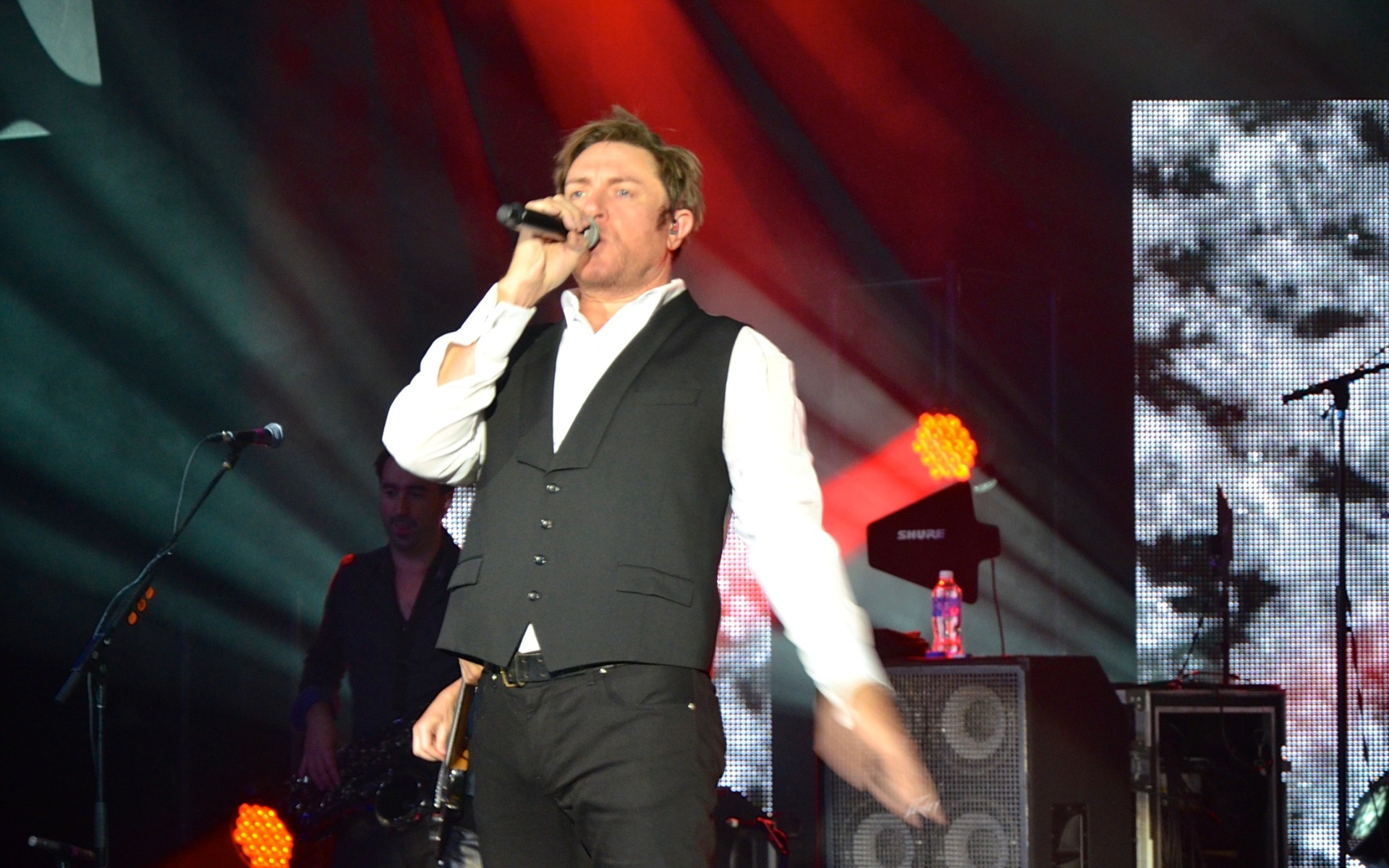 Simon Le Bon, singer for Duran Duran, on stage.