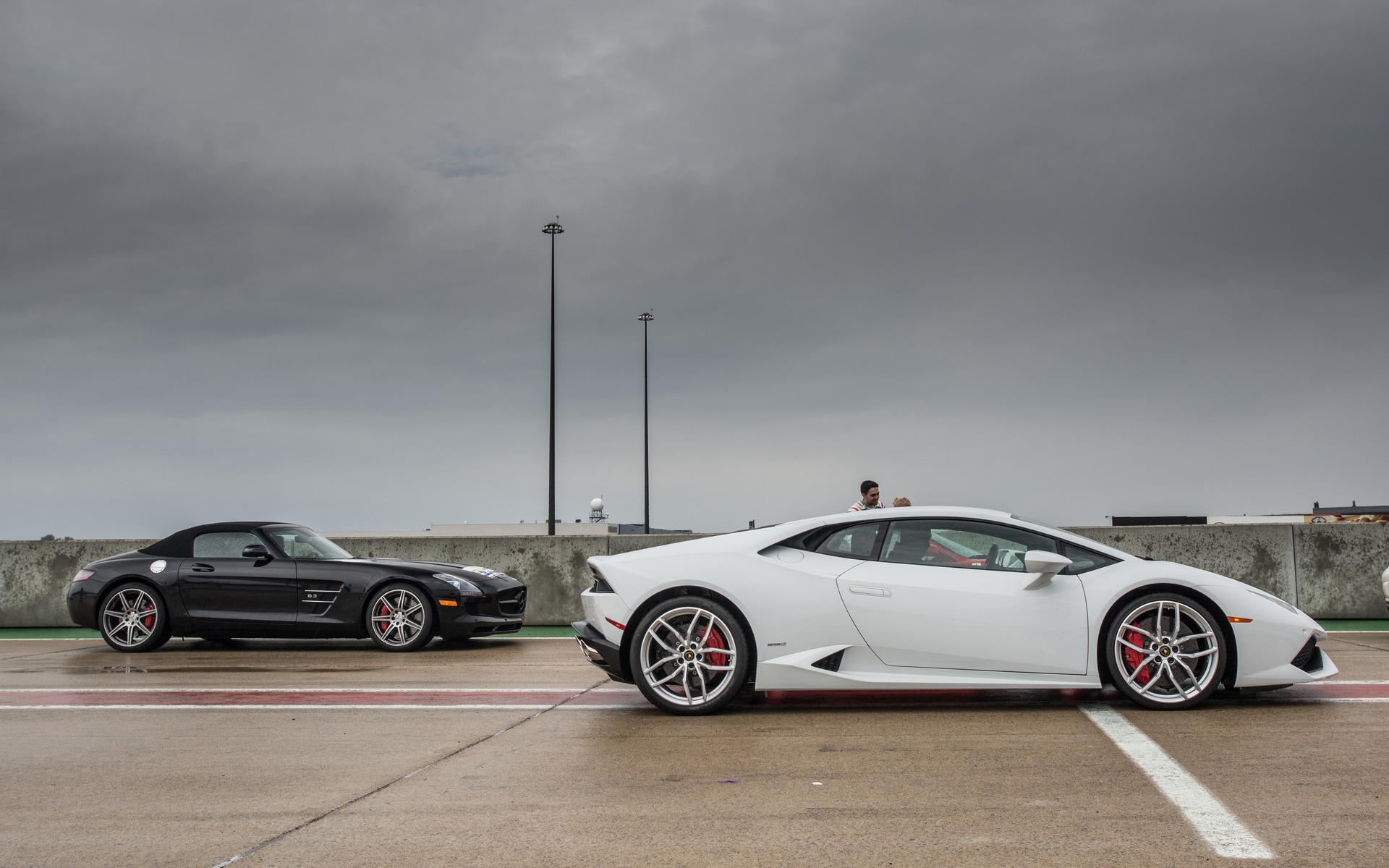 The new Lamborghini Huracán and a Mercedes-Benz AMG SLS Roadster.