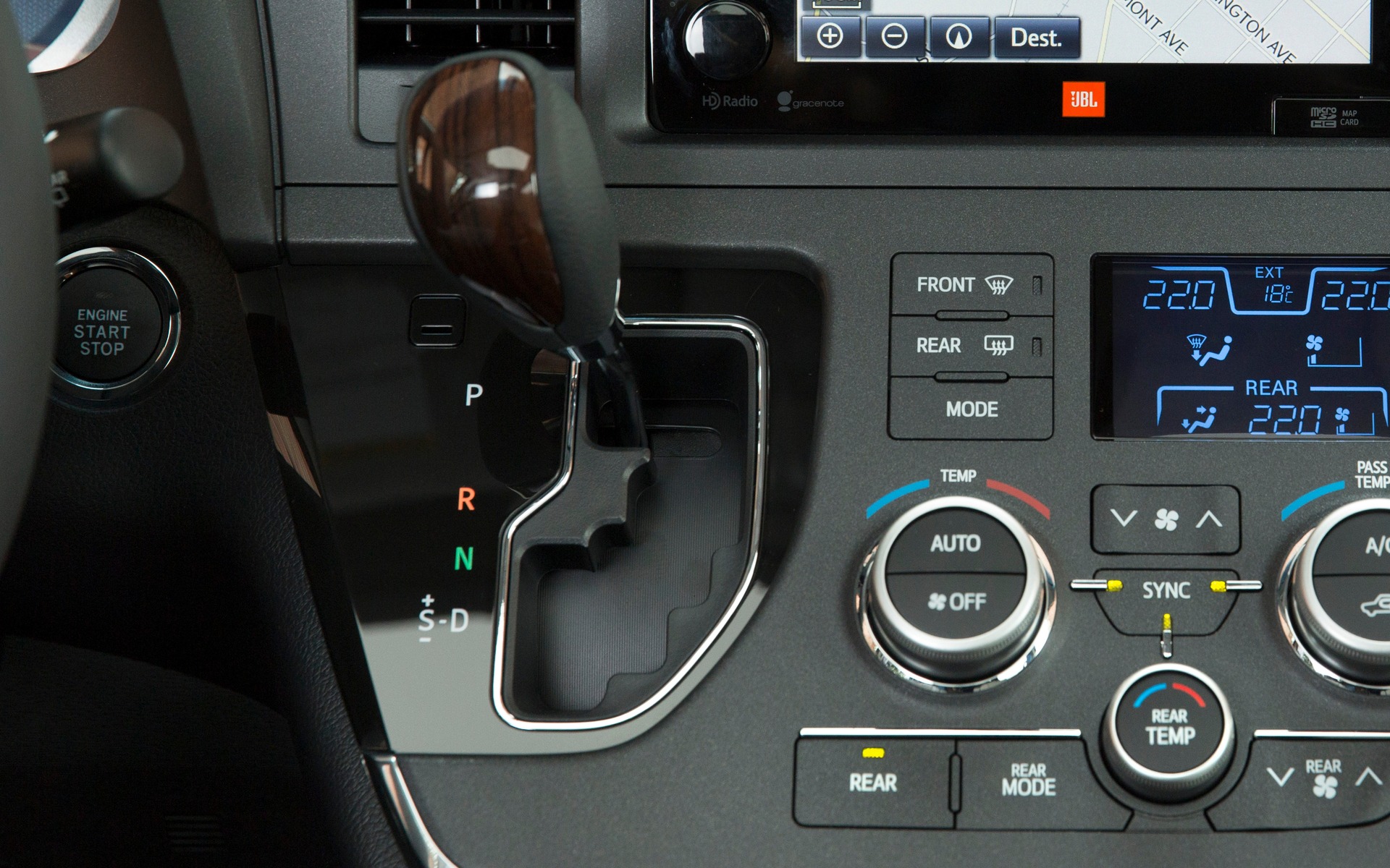 The gear shift lever is within easy reach.