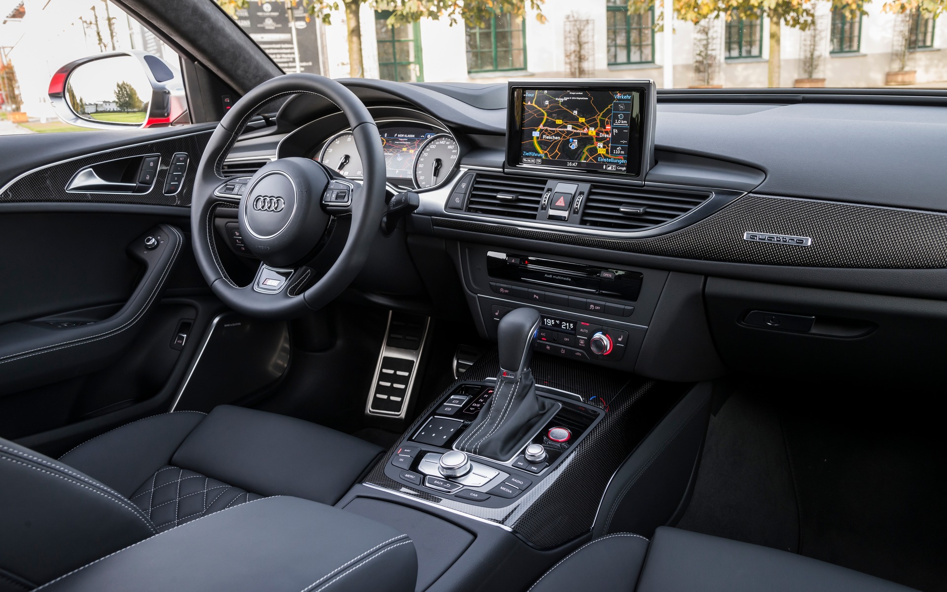 The interior of the A6 makes use of neutral tones and wood accents.