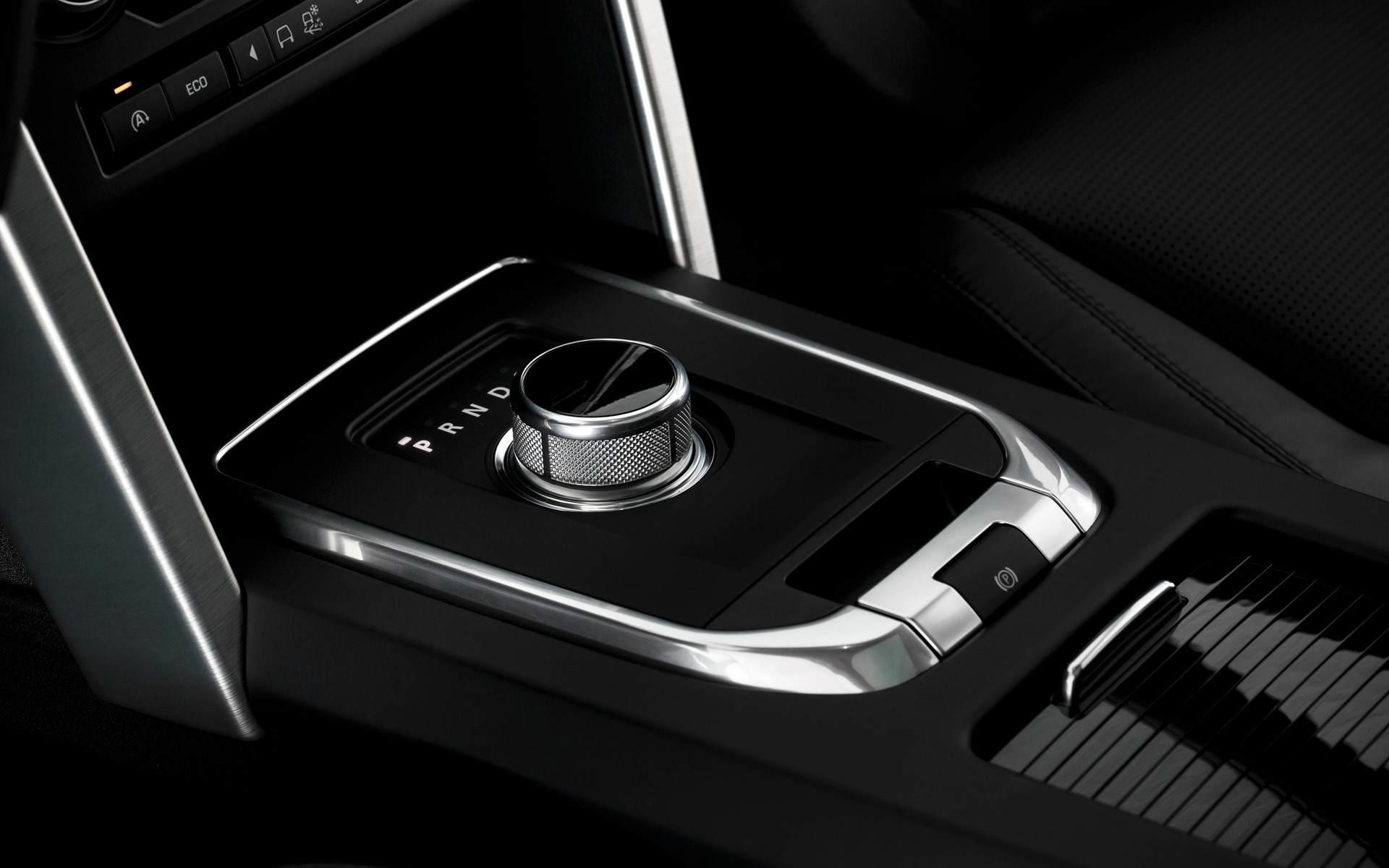 The rotary gear shift selector rises once you turn on the car.