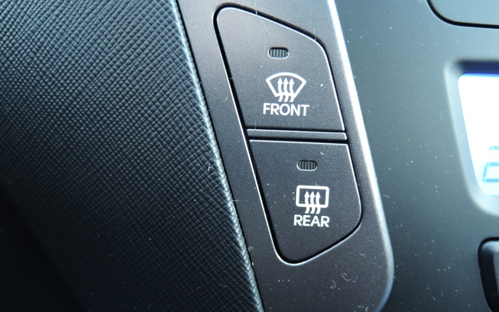 The front and rear defrost buttons.