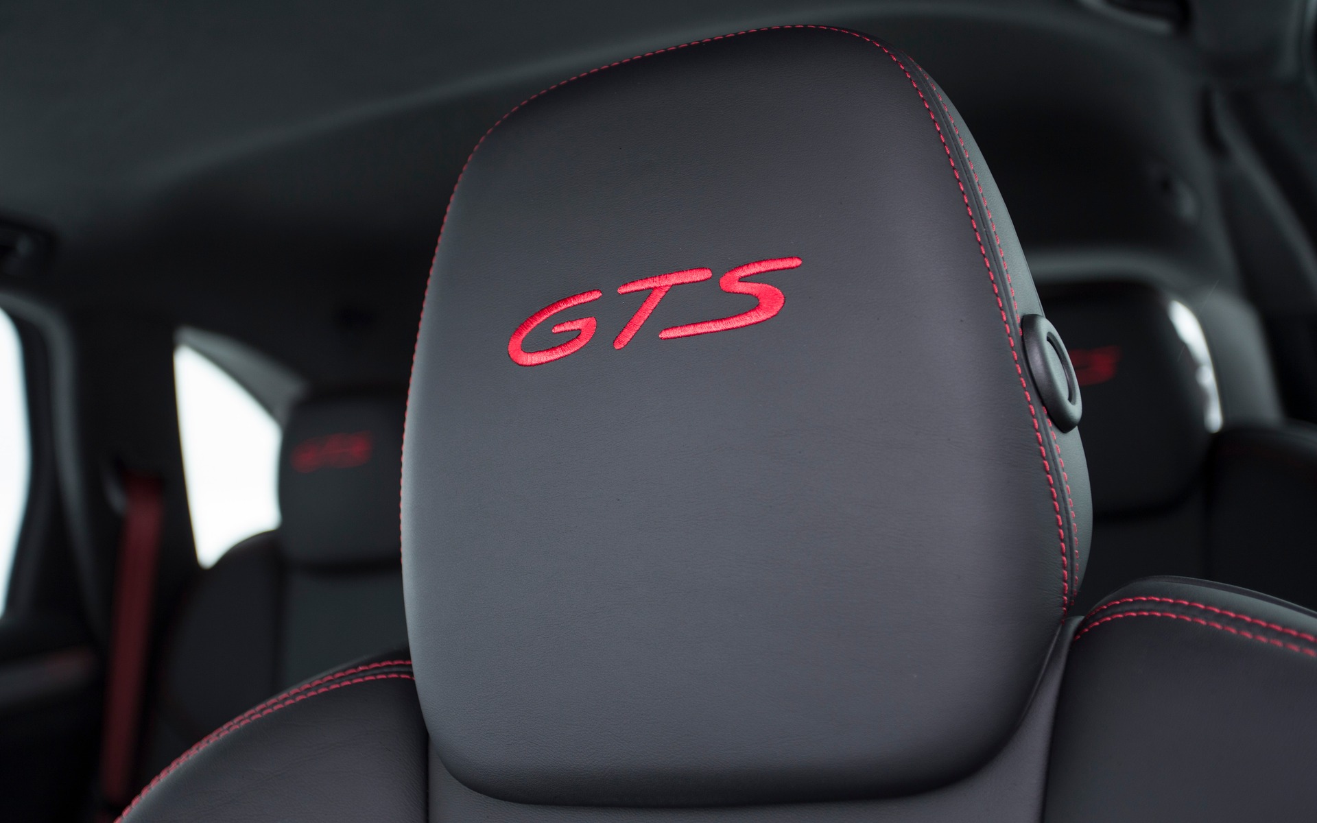 Red stitching and GTS logo on the seats.