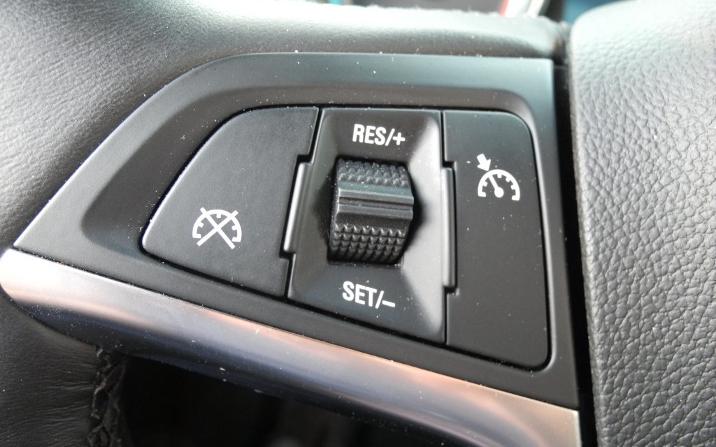 The cruise controls is situated on the left spoke of the steering wheel.