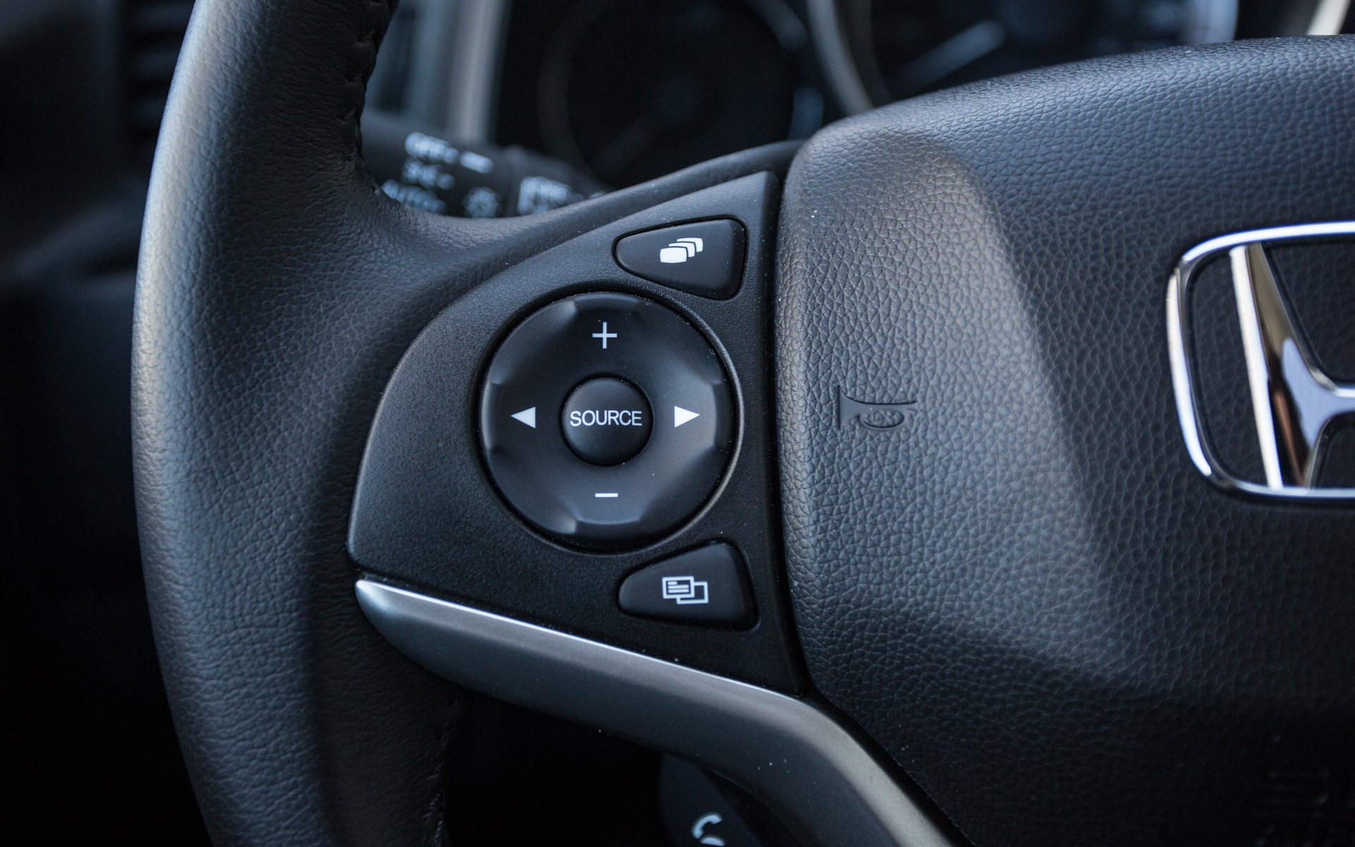 The steering wheel mounted buttons on the Fit are really useful.