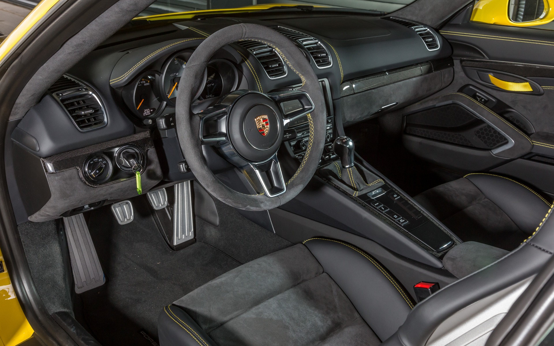 The GT4's cockpit looks designed for racing.