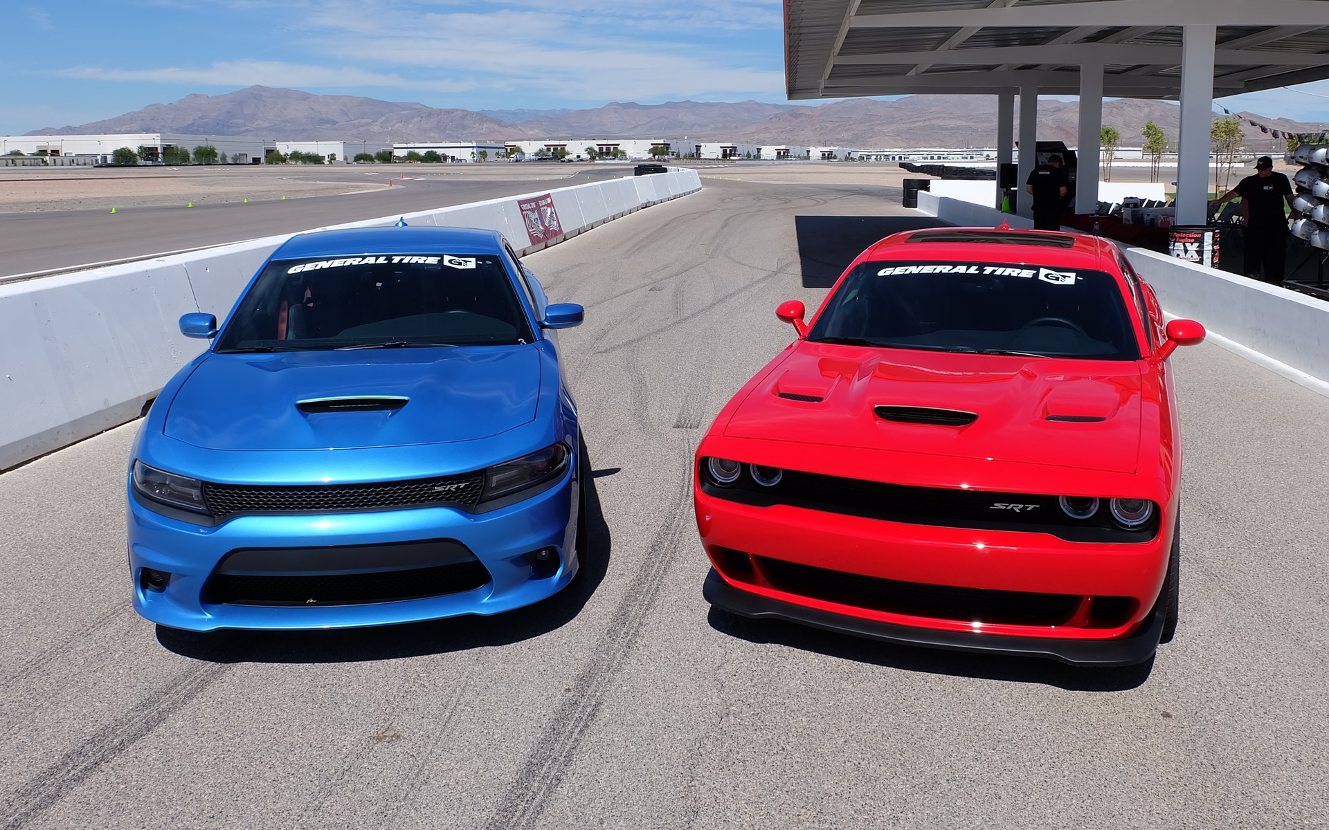 A Charger SRT and a Challenger Hellcat ready for some action on the track.