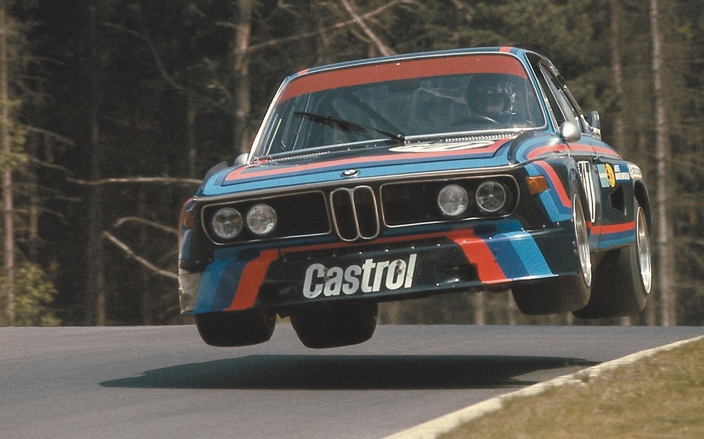 A BMW 3.0 CSL that just took Flugplatz with too much enthusiasm.
