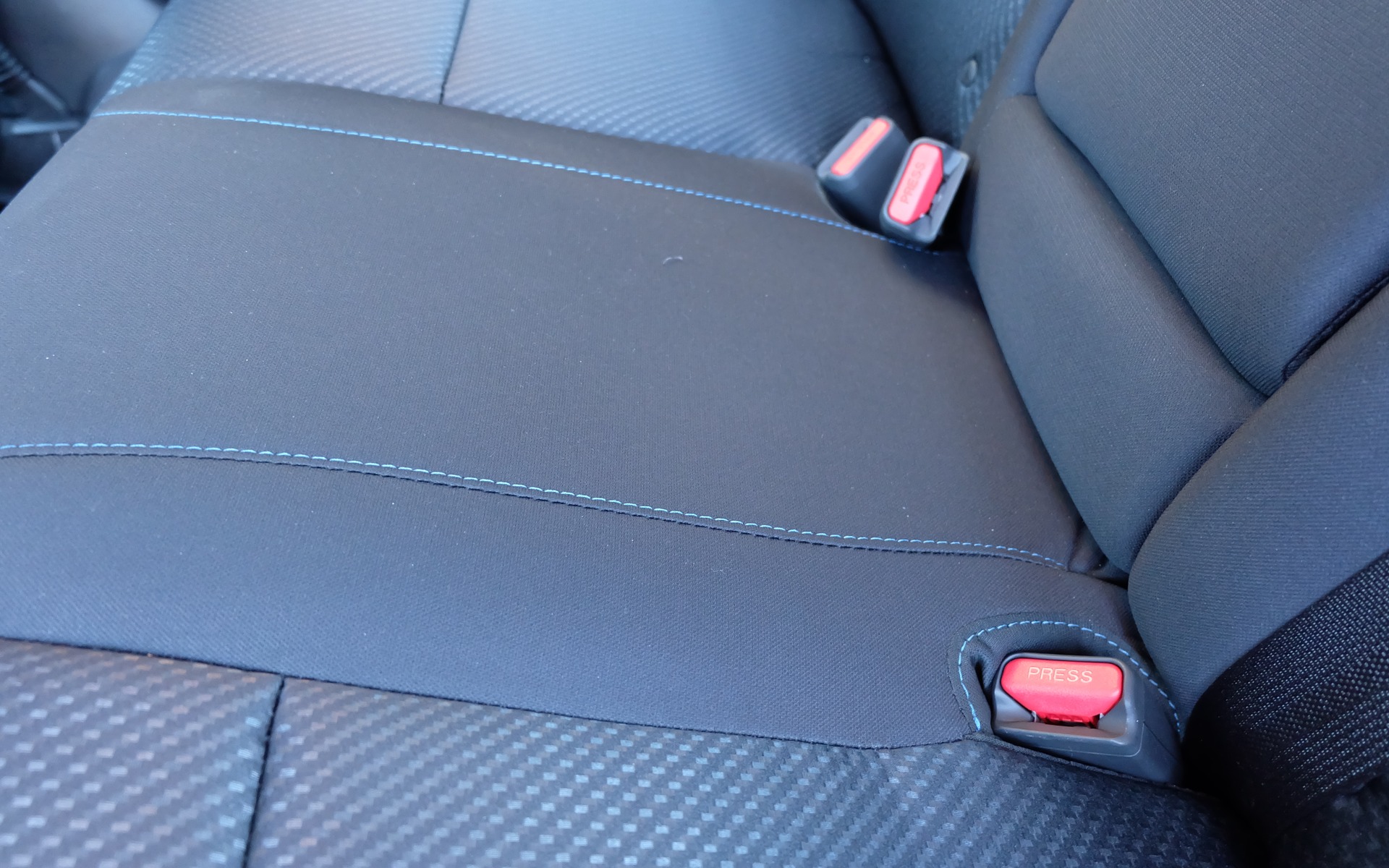 The Altima SR gets cloth seats with blue contrast stitching
