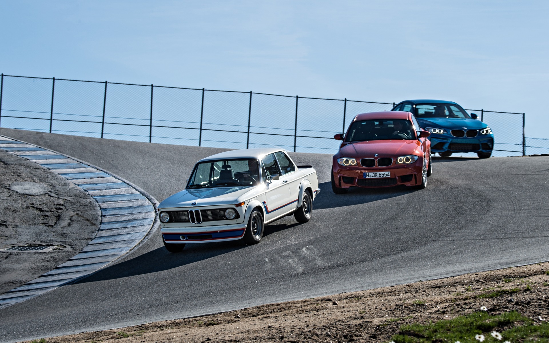 Front left to right: BMW 2002 Turbo, BMW 1 Series M Coupé and BMW M2.