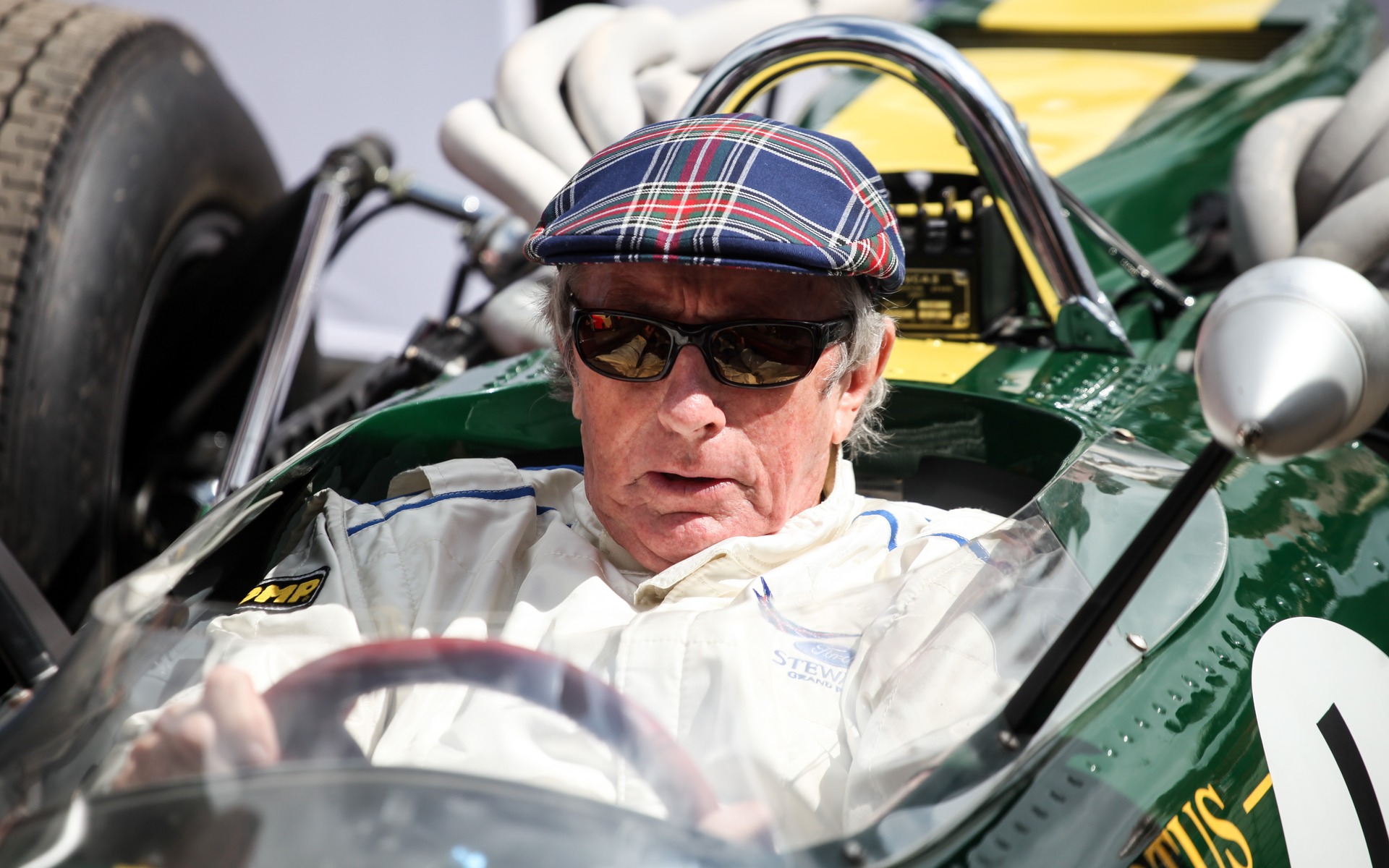 Sir Jackie Stewart, three-time F1 World Champion driving a Lotus-BRM