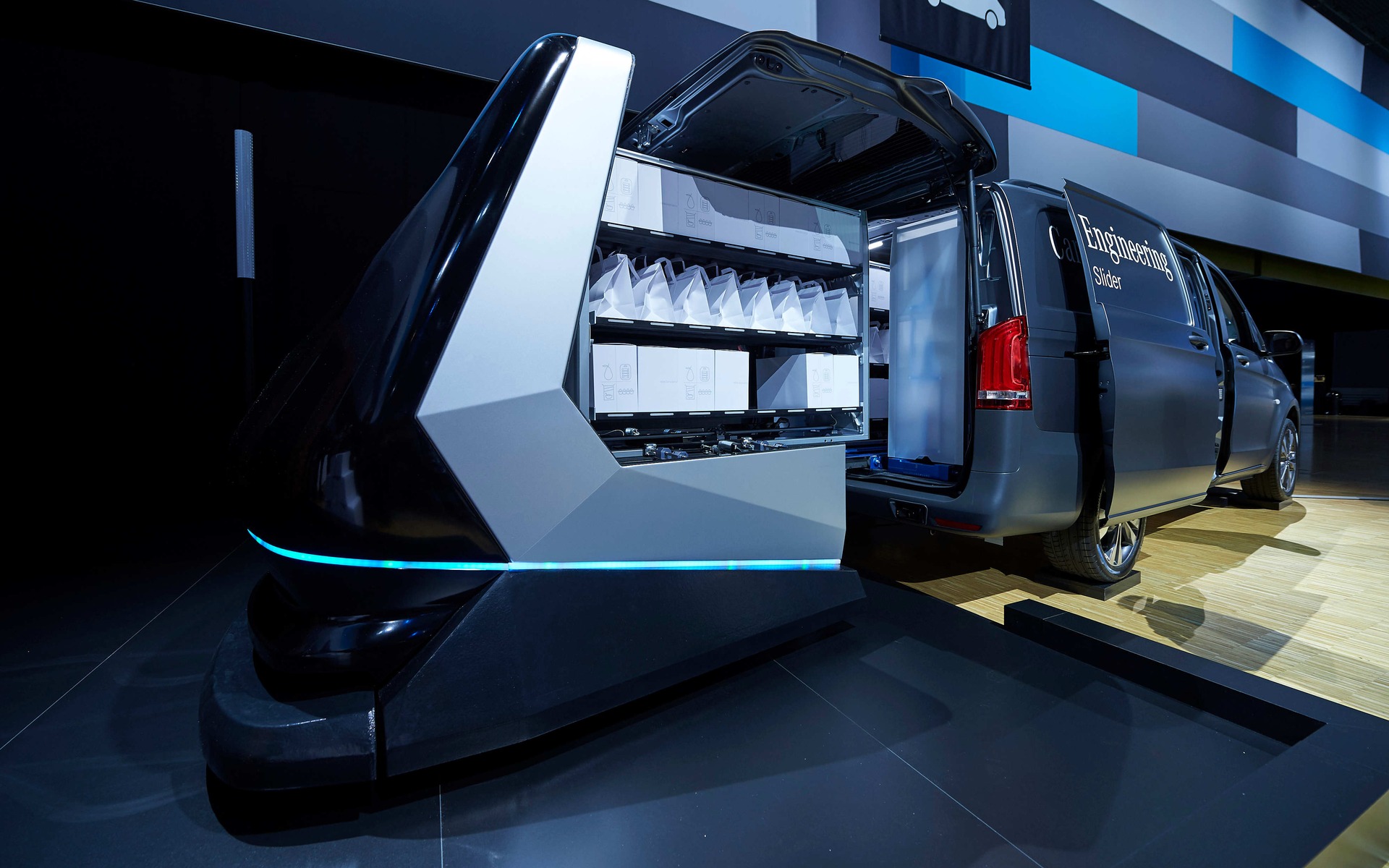 Driverless conveyor systems load the stocked merchandise.