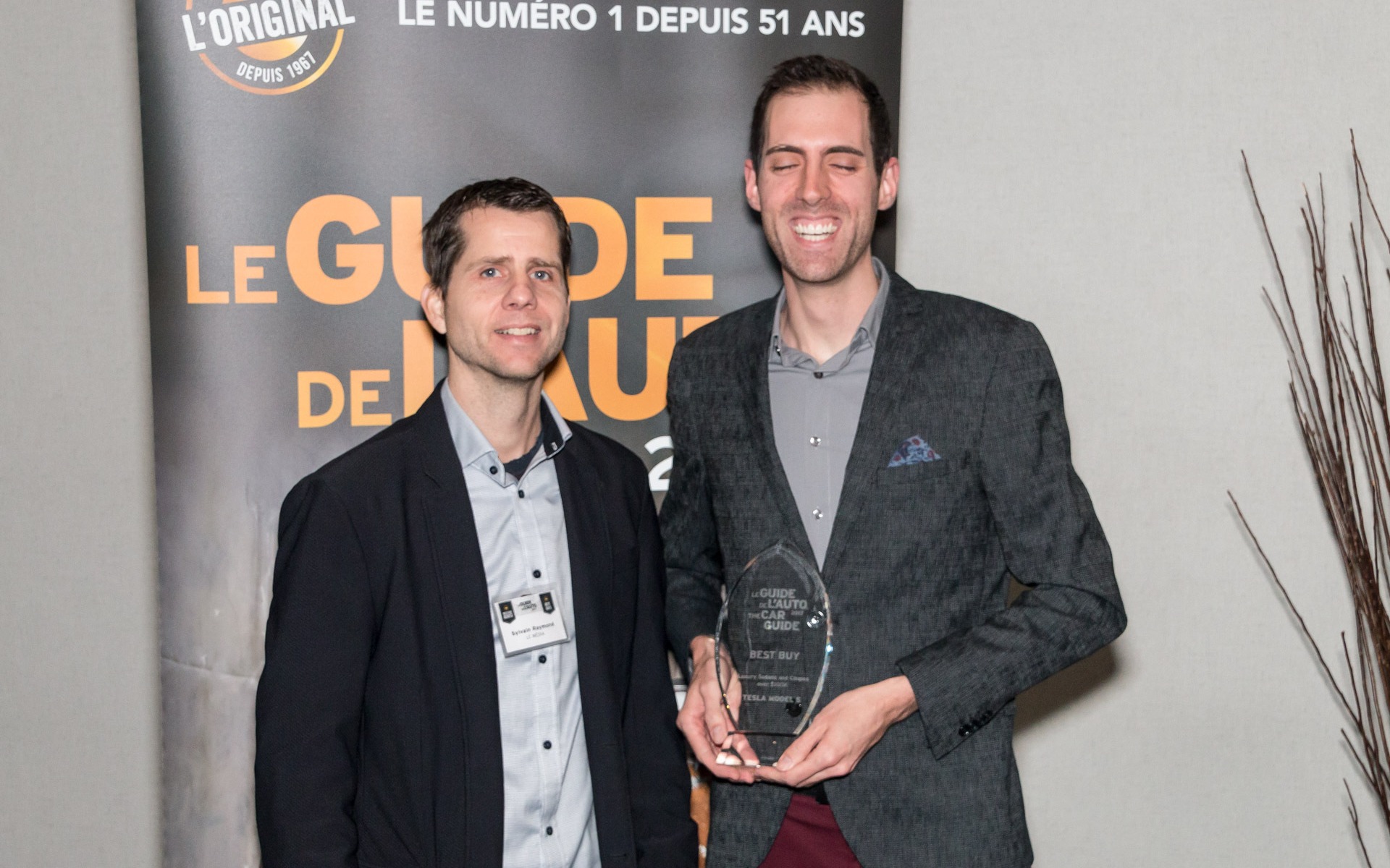 <p>Sylvain Raymond with Martin Paquet of Tesla Motors.</p>