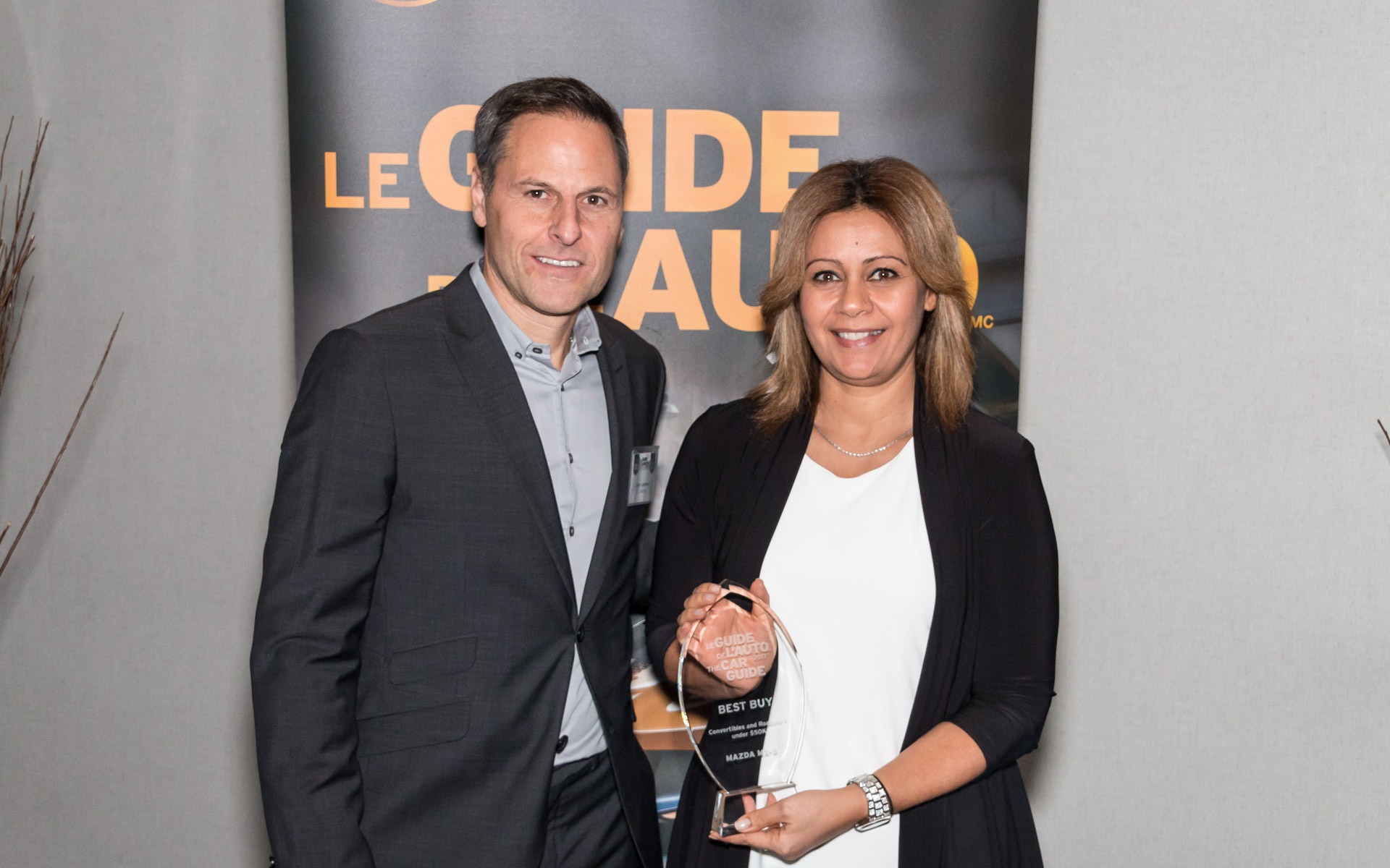 <p>Jean Lemieux with Rania Guirguis of Mazda Canada Inc.</p>