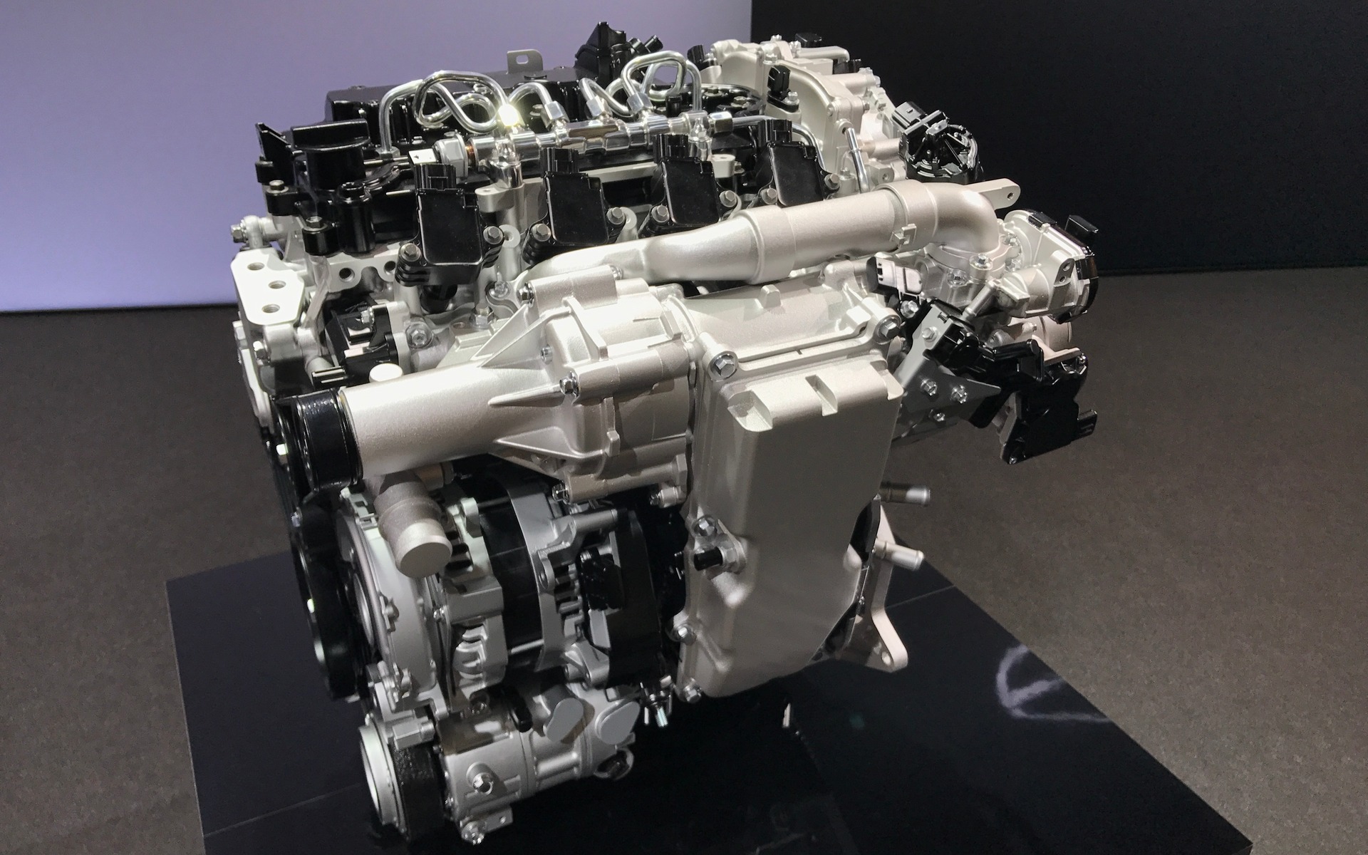 <p>Mazda's SKYACTIV-X engine. Note the belt-driven supercharger.</p>